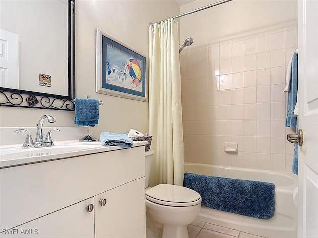 bathroom featuring toilet, tile patterned flooring, shower / bath combo with shower curtain, and vanity