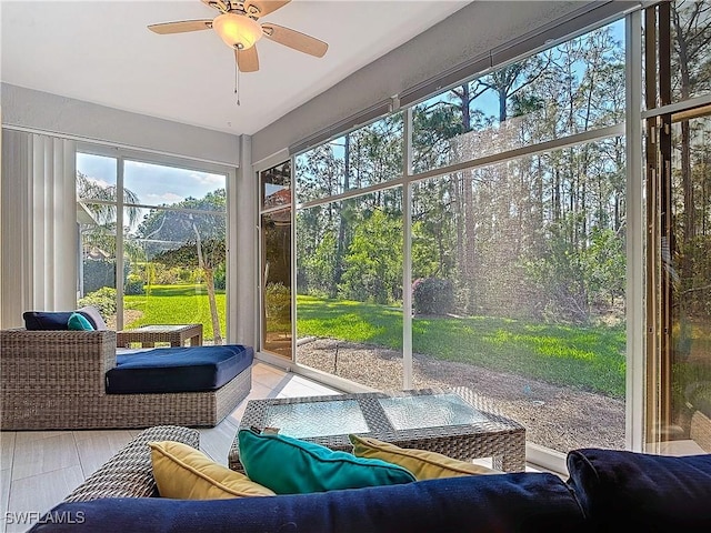 sunroom with a ceiling fan