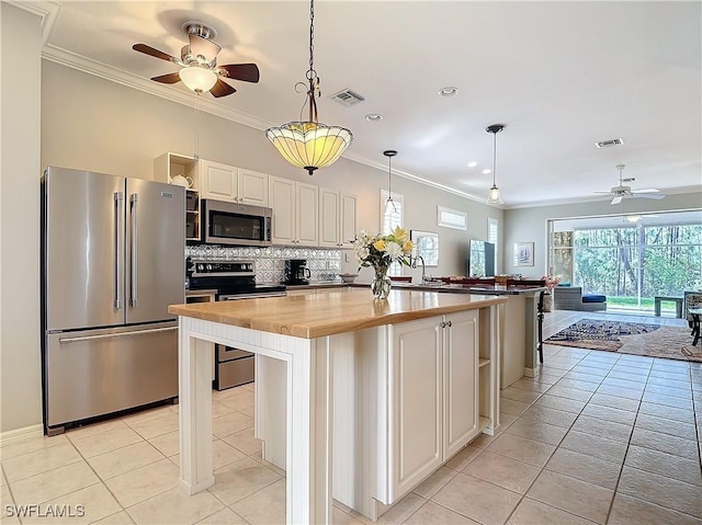 kitchen with crown molding, open shelves, stainless steel appliances, backsplash, and wood counters