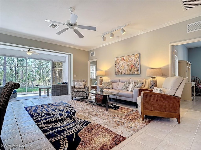 living area with visible vents and crown molding