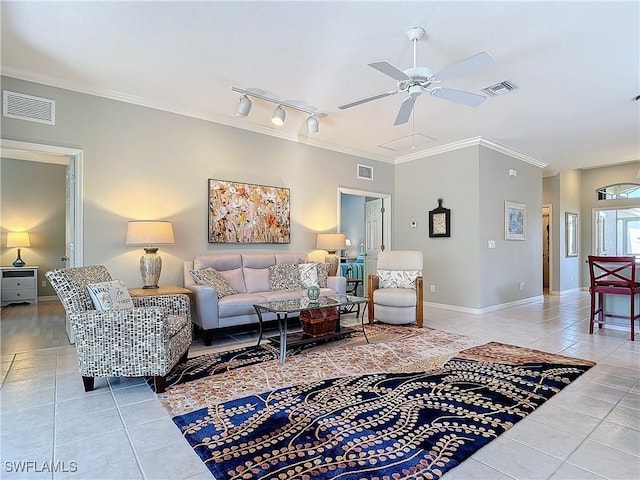 living room with ornamental molding, visible vents, and light tile patterned floors