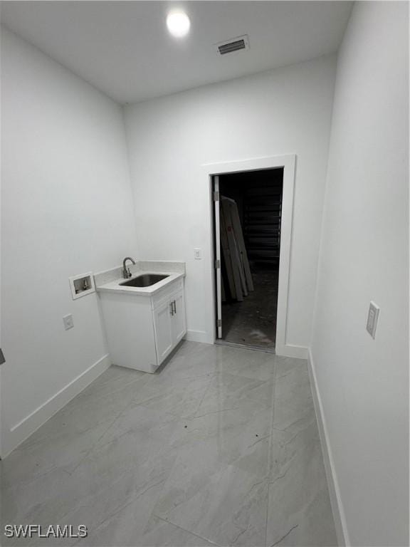 washroom with washer hookup, a sink, visible vents, baseboards, and marble finish floor