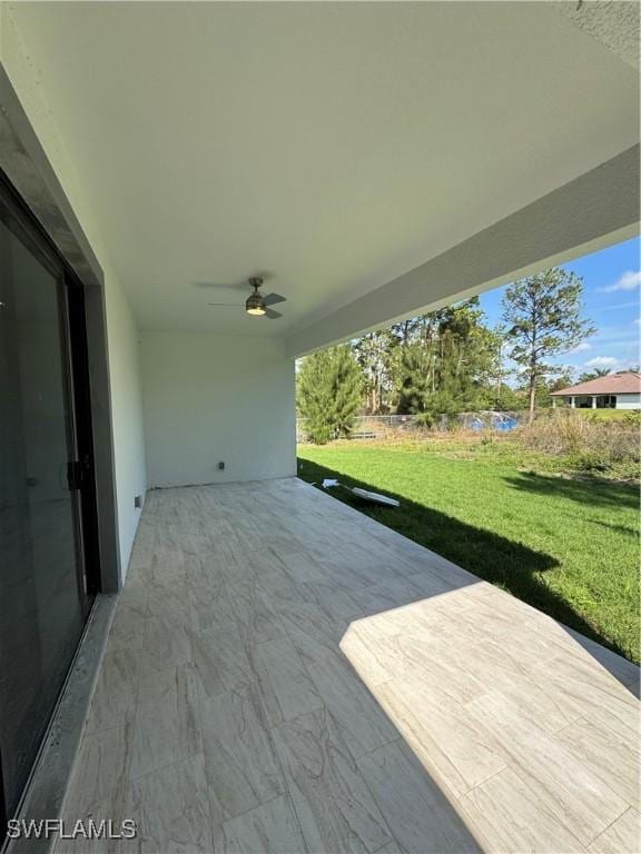 view of patio / terrace featuring ceiling fan