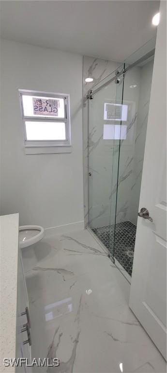 bathroom with marble finish floor, a marble finish shower, and baseboards