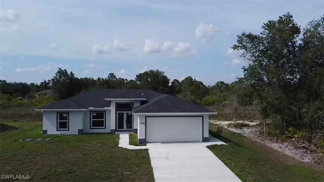 1025 Pilgrim St E, Lehigh Acres, FL 33974 - view of front facade featuring a garage, a front lawn, driveway, stucco siding, and roof with shingles