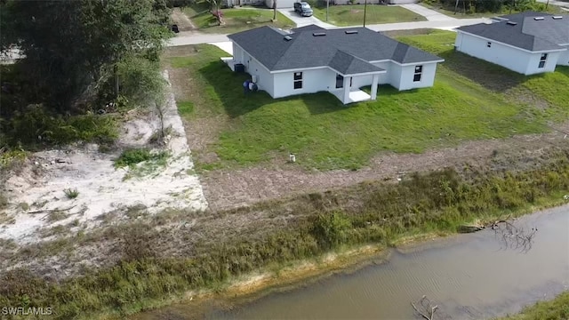 1025 Pilgrim St E, Lehigh Acres, FL 33974 - aerial view of property and surrounding area featuring a nearby body of water