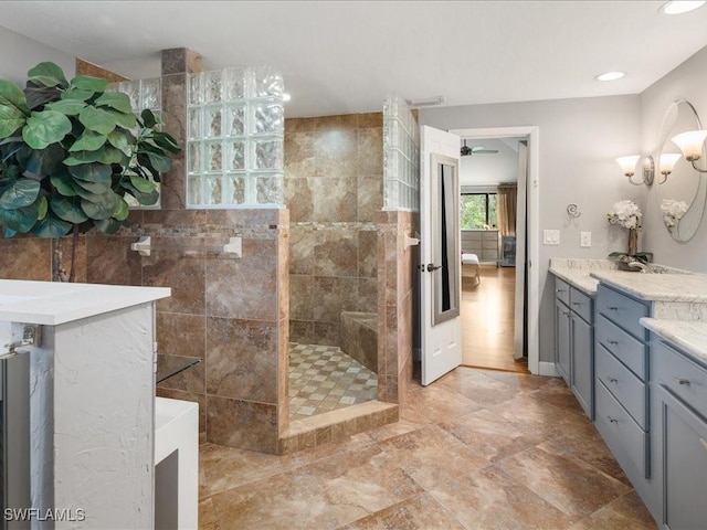 full bath featuring vanity and walk in shower