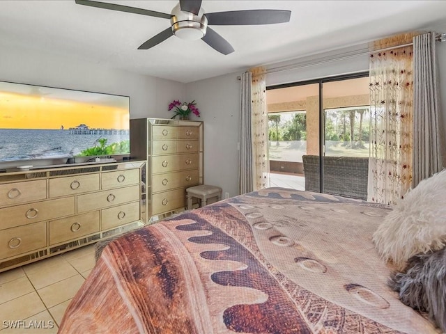 bedroom with access to exterior, ceiling fan, and light tile patterned flooring