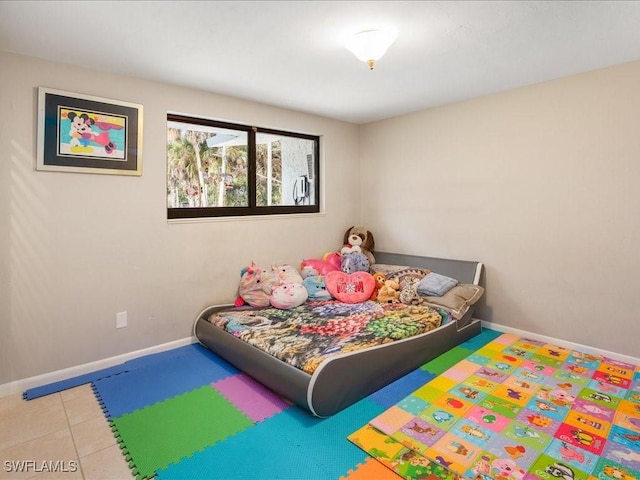 tiled bedroom with baseboards