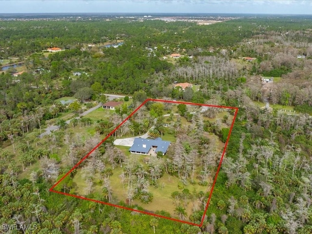 aerial view featuring a wooded view