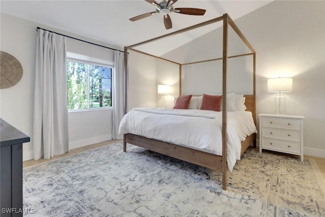 bedroom featuring ceiling fan, baseboards, and vaulted ceiling