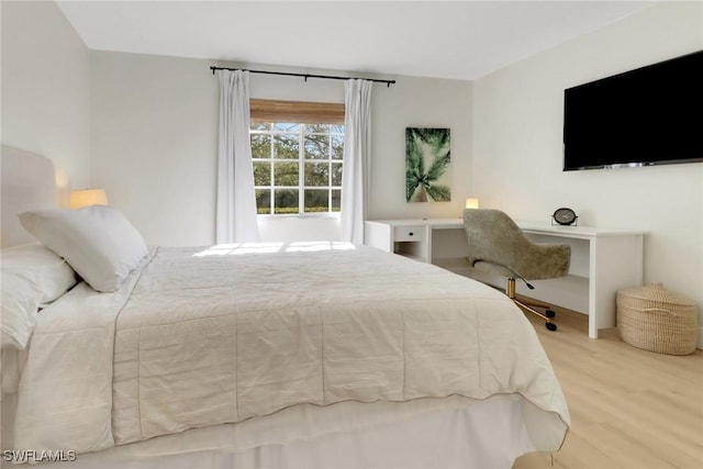 bedroom with wood finished floors