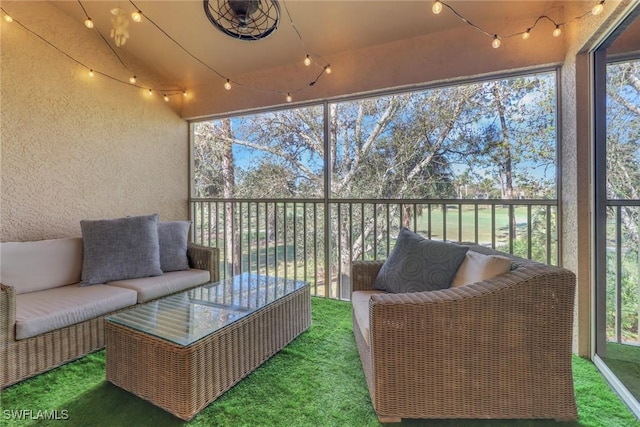 sunroom with vaulted ceiling and plenty of natural light