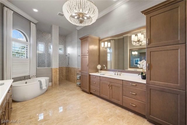 full bathroom featuring a notable chandelier, visible vents, a freestanding bath, vanity, and a walk in shower