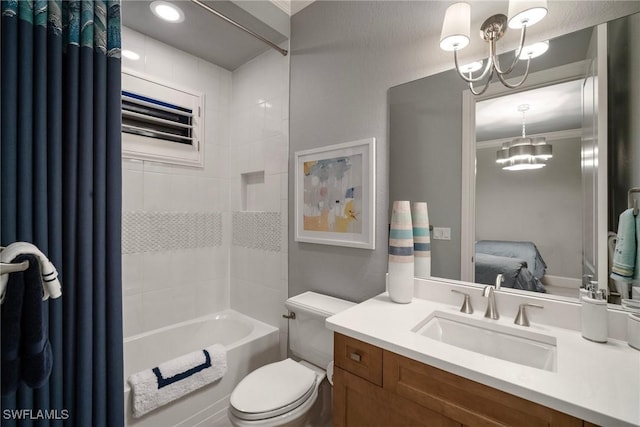 full bath featuring tub / shower combination, toilet, an inviting chandelier, and vanity