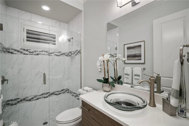 full bath with toilet, ornamental molding, vanity, a shower stall, and recessed lighting