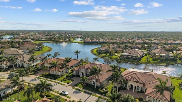 birds eye view of property with a water view and a residential view