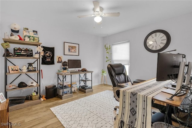 home office featuring a ceiling fan and wood finished floors