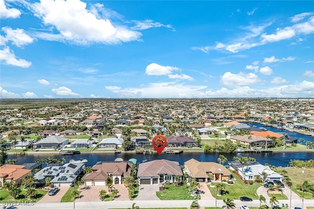 bird's eye view featuring a residential view and a water view