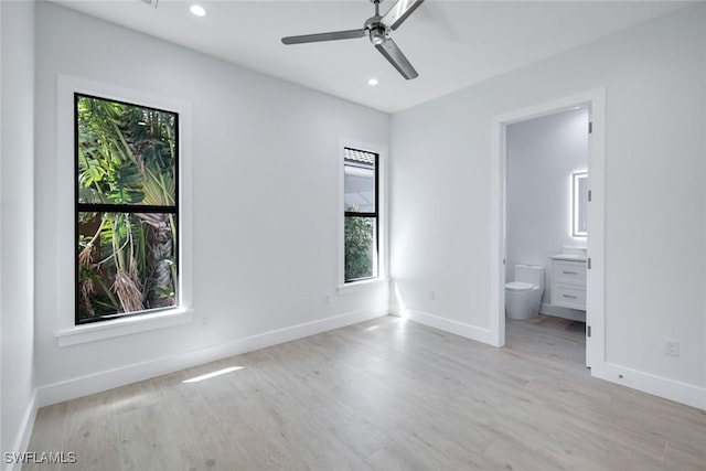 unfurnished bedroom featuring recessed lighting, baseboards, and light wood-style floors