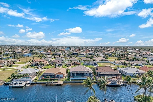 aerial view with a residential view and a water view