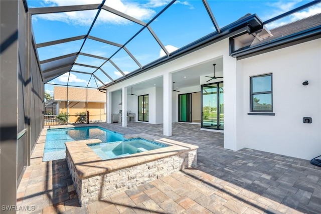 view of swimming pool with a patio area, a ceiling fan, a pool with connected hot tub, and a lanai