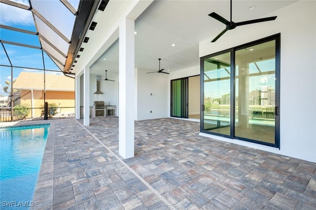 view of patio / terrace with an outdoor pool, glass enclosure, area for grilling, and ceiling fan