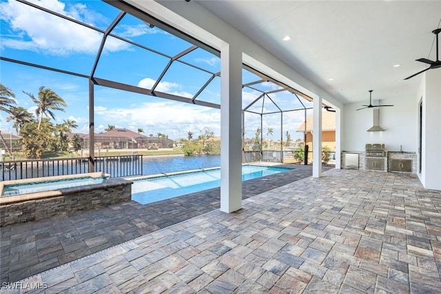 view of swimming pool featuring a patio area, area for grilling, and a lanai