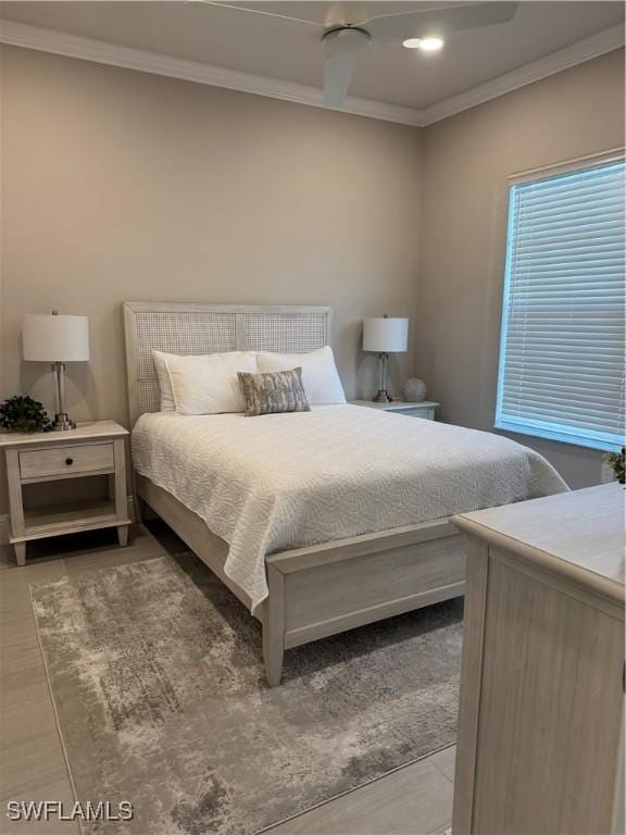 bedroom featuring ornamental molding and ceiling fan