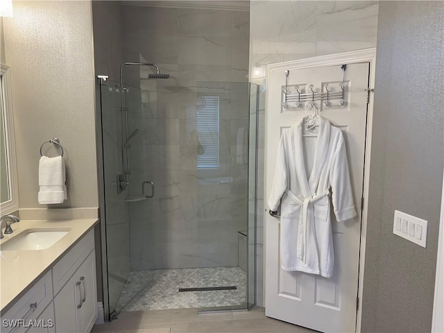 full bath featuring a shower stall and vanity