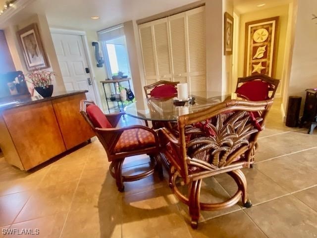 dining area with light tile patterned floors