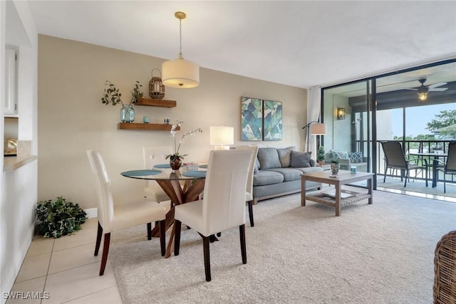 dining area featuring floor to ceiling windows and light tile patterned floors