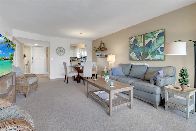 living area with light carpet