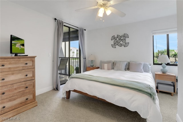 bedroom featuring light carpet, access to outside, baseboards, and a ceiling fan