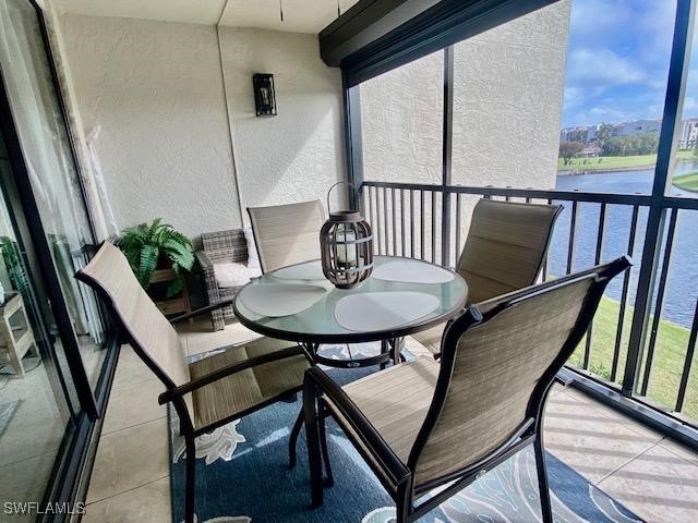 balcony featuring a water view