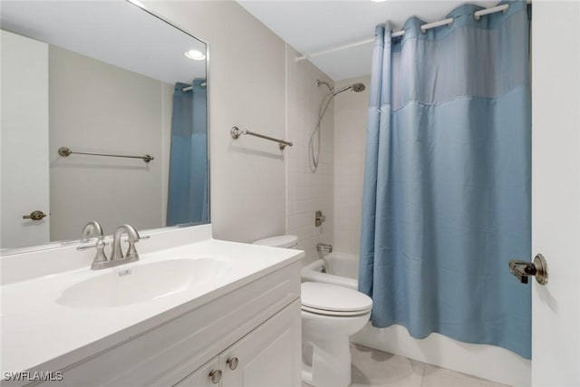 bathroom featuring vanity, shower / bath combination with curtain, and toilet