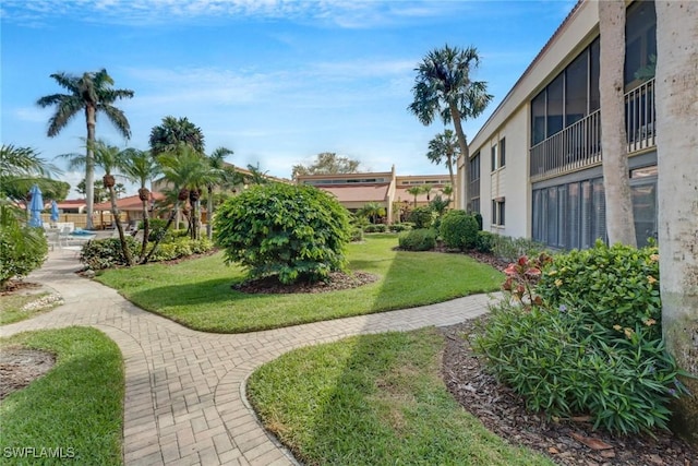 view of home's community featuring a lawn