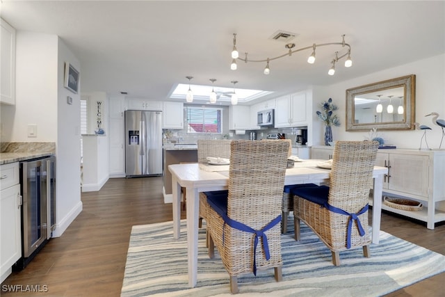 dining room with baseboards, wine cooler, visible vents, and dark wood-style flooring