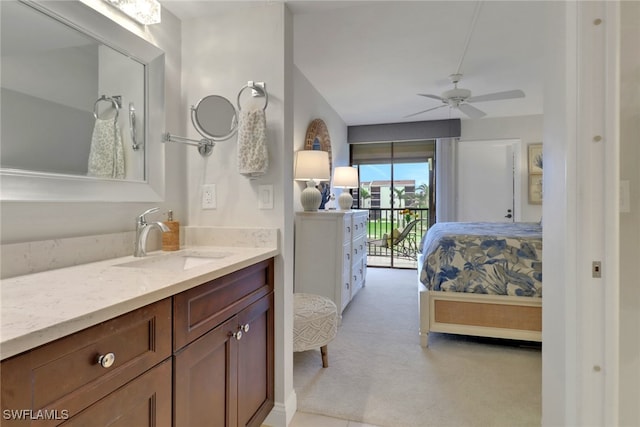 bathroom featuring ceiling fan, ensuite bath, and vanity