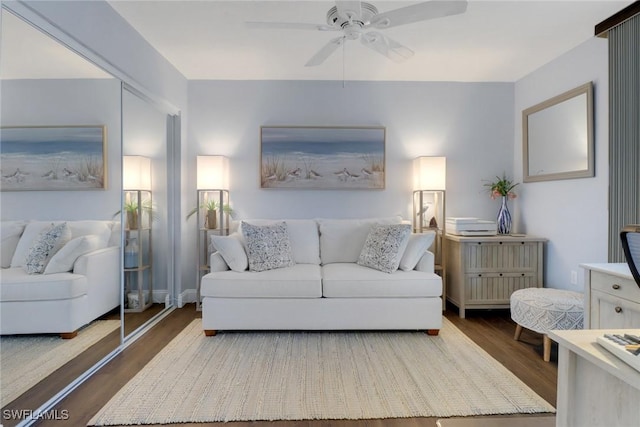 living room with ceiling fan and wood finished floors