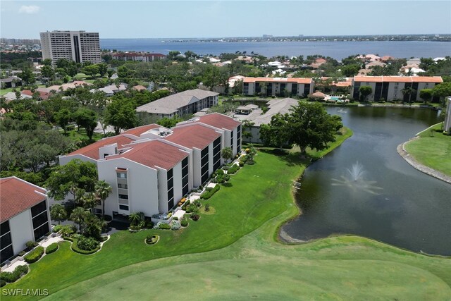 aerial view featuring view of golf course and a water view