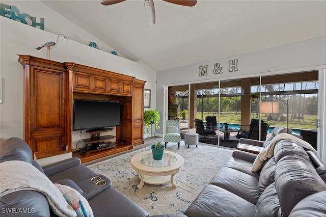 living room featuring vaulted ceiling, ceiling fan, and wood finished floors