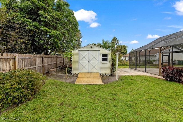 view of shed with a fenced backyard