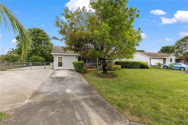 ranch-style house with a front lawn and fence