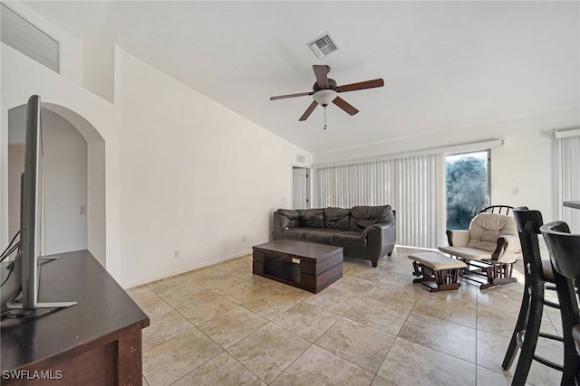 living room featuring light tile patterned floors, visible vents, arched walkways, and a ceiling fan