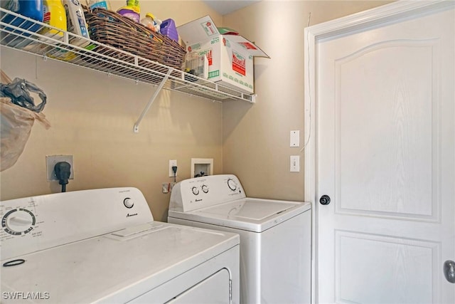 washroom with laundry area and washing machine and clothes dryer