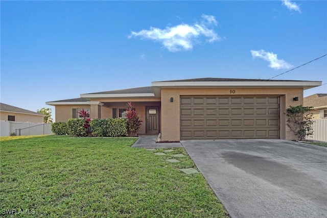 ranch-style house with an attached garage, fence, driveway, stucco siding, and a front lawn