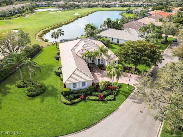 birds eye view of property featuring golf course view and a water view