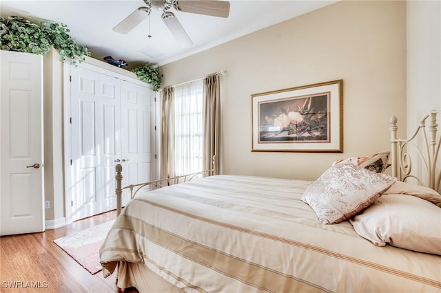 10731 Wintercress Dr, Estero, FL 34135 - bedroom with a ceiling fan, light wood-style flooring, and a closet