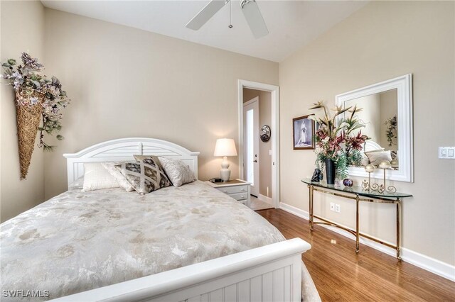 10731 Wintercress Dr, Estero, FL 34135 - bedroom featuring baseboards, wood finished floors, and a ceiling fan